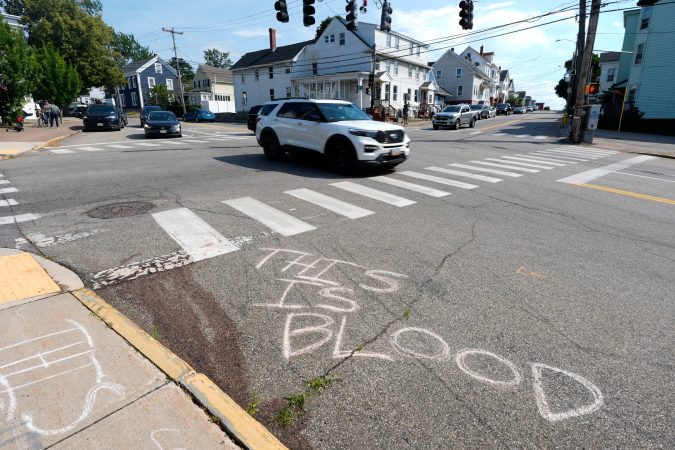 Blood is seen on the pavement near the scene of a shooting involving U.S. Immigration and Customs Enforcement, Monday, July 13, 2026 in Biddeford, Maine.