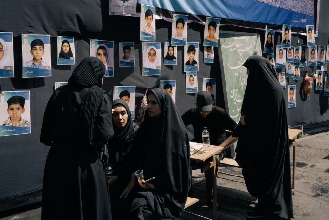 Families of children killed in bombing of Iranian school join leader’s funeral