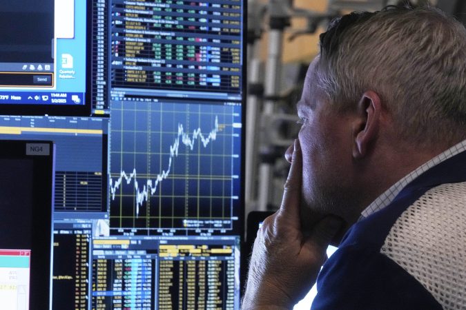 Stocks waver on Wall Street while crude oil prices fall for the first time in a week