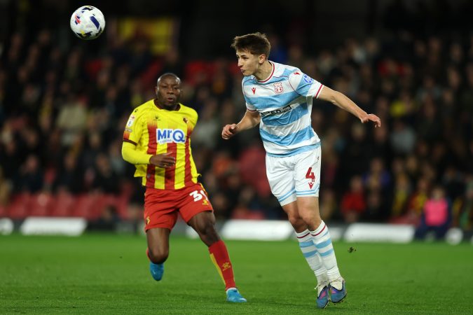 Max Cleworth (right) in action for Wrexham in March.