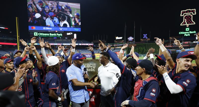 HBCU American League team members celebrate around Ken Griffey Jr. (center, in white shirt) after winning the HBCU Swingman Classic.