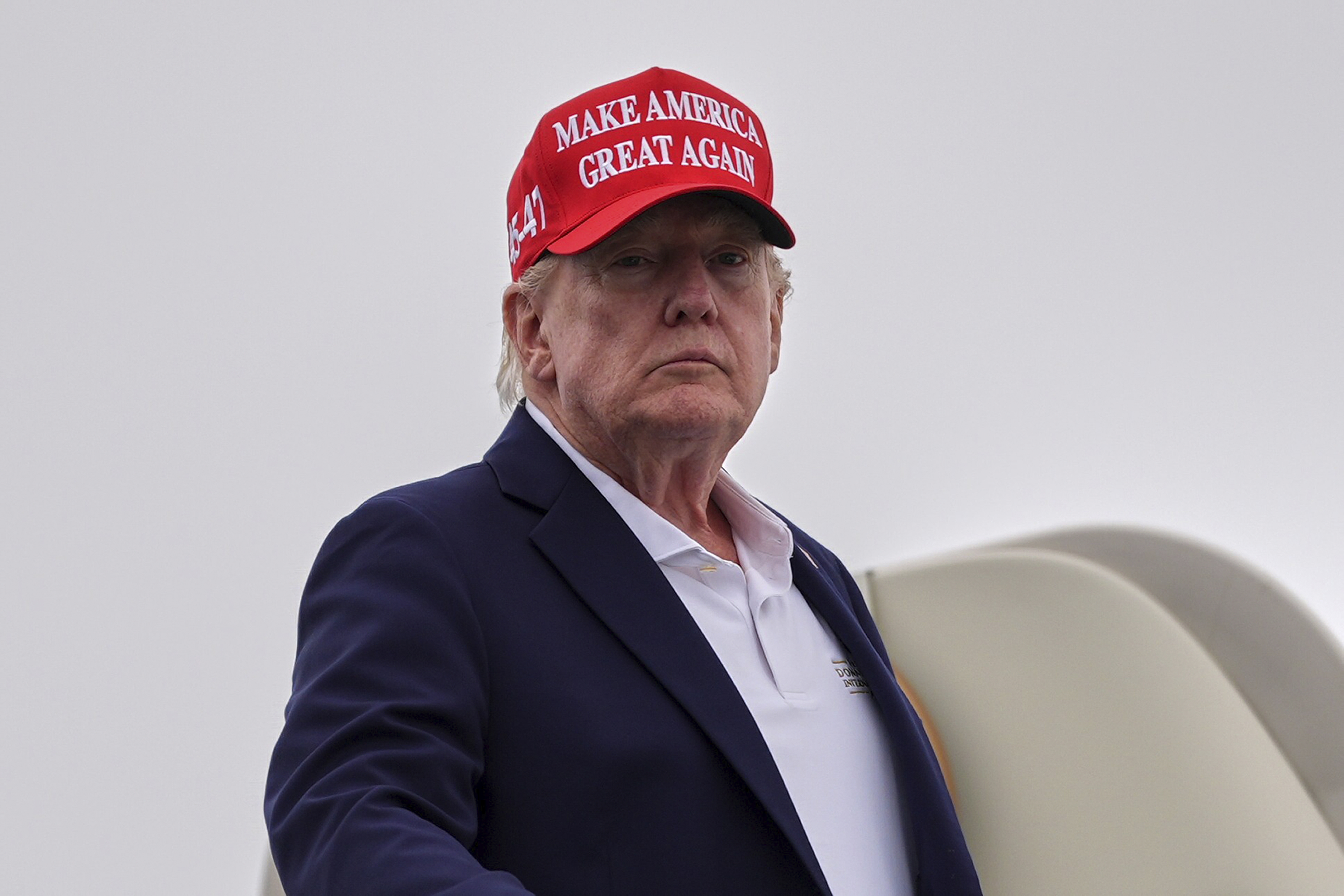 President Donald Trump boards Air Force One on Sunday, Aug. 16, 2026, in Morristown, N.J.