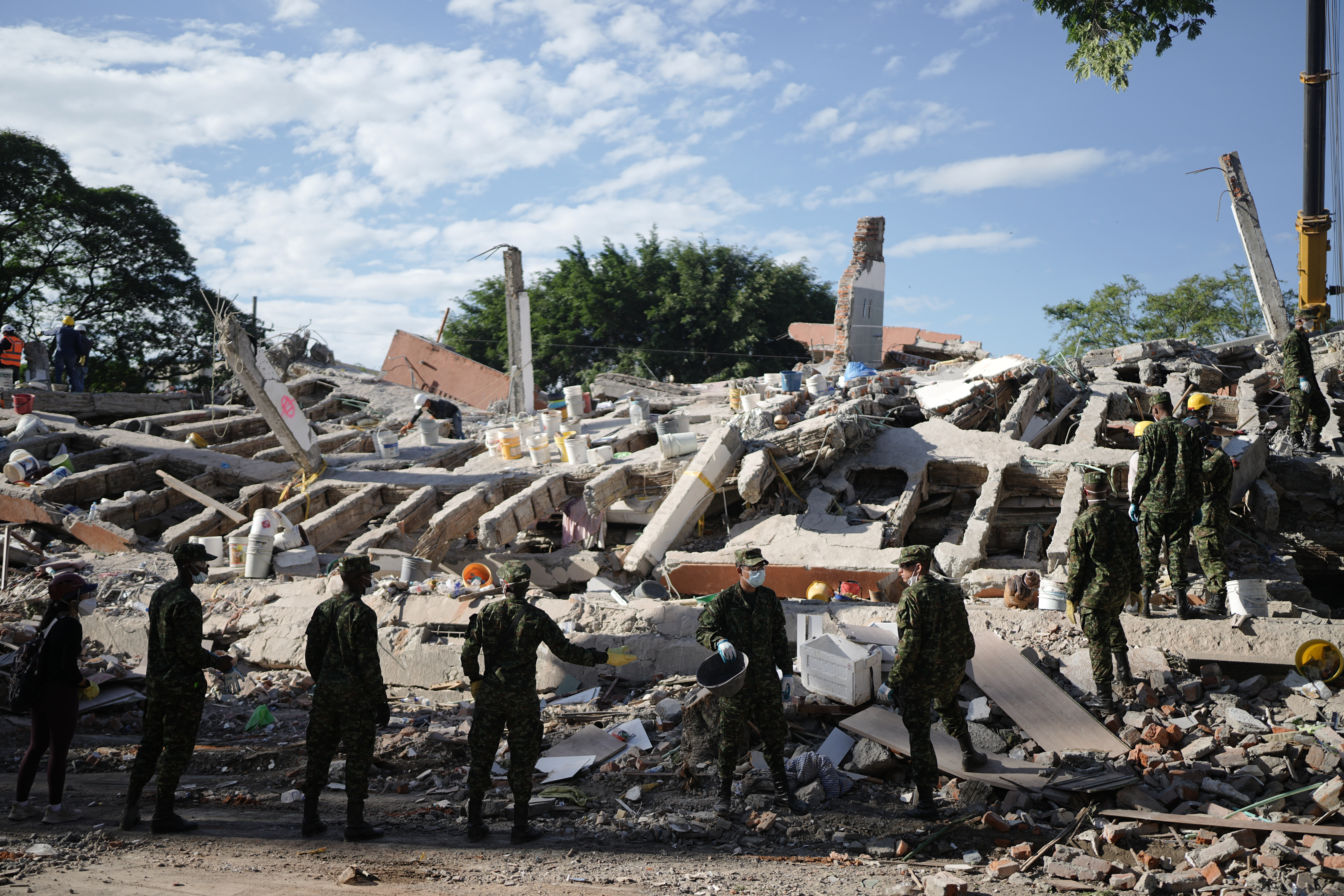 Rescuers call for silence around earthquake rubble as window for survival narrows in Colombia