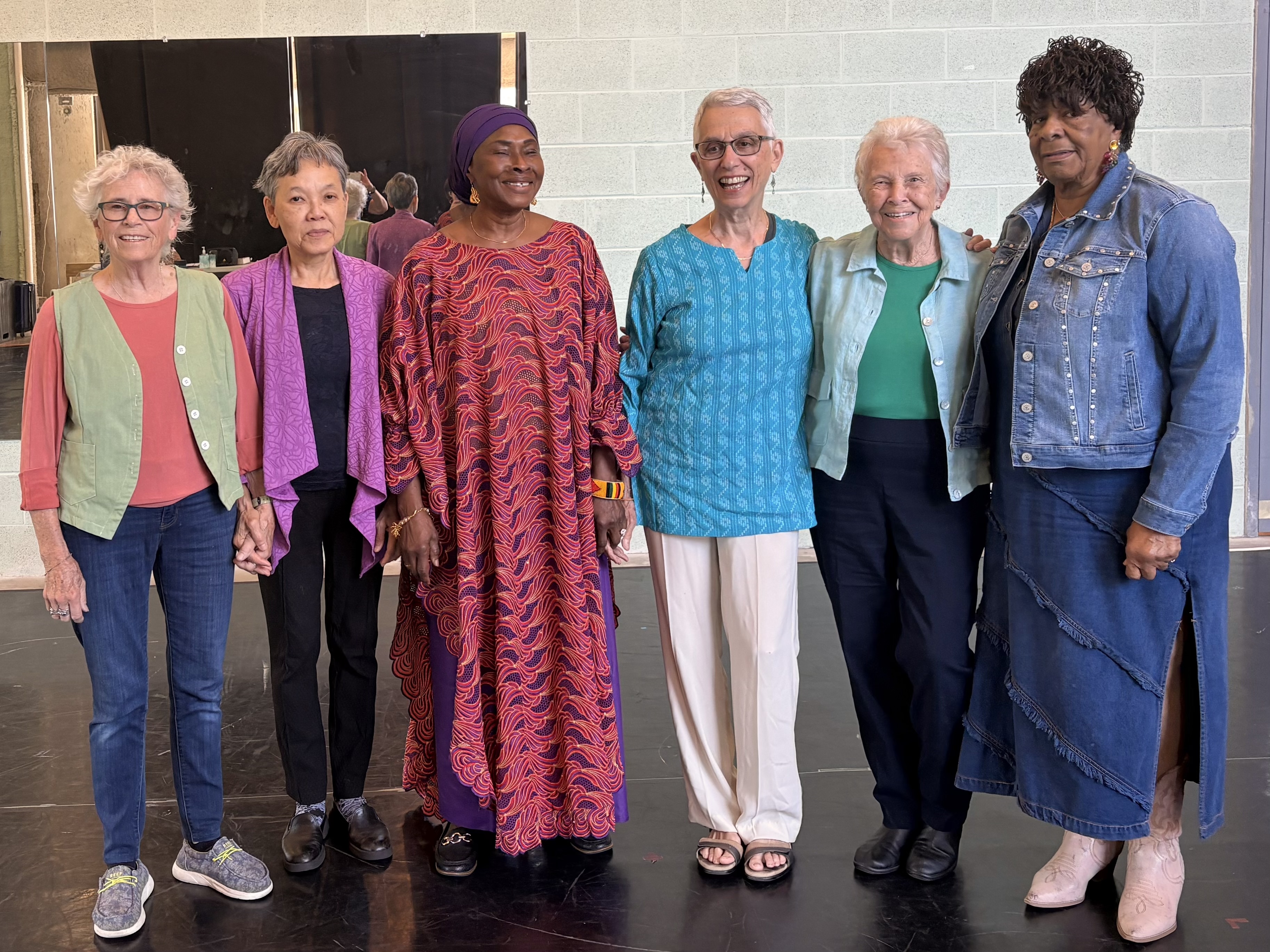 An 80 year old rabbi from Chestnut Hill, a Senegalese immigrant, a former Vietnamese refugee walk onto a stage