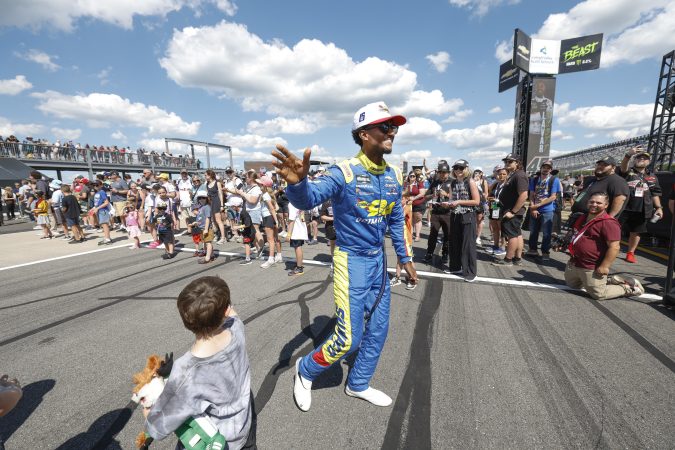 Scott waves to a young fan at Pocono.