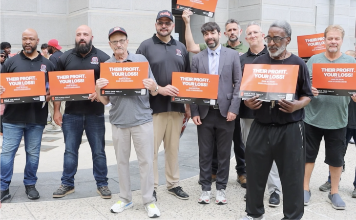 Who’s behind the orange signs around Philly criticizing rogue developers?