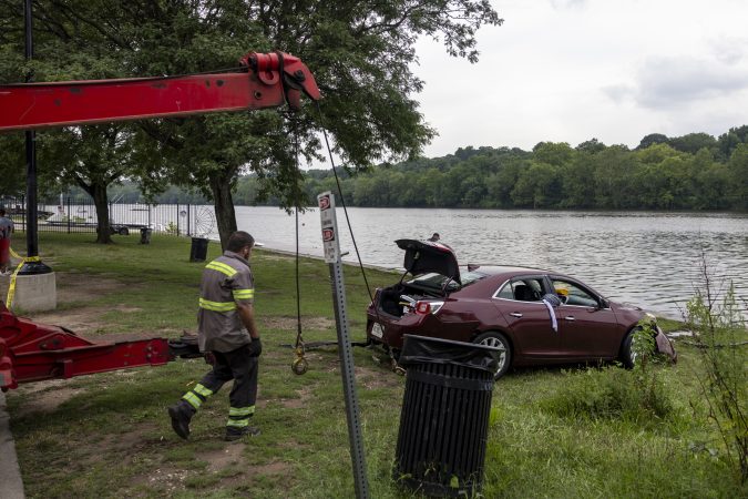 Two elite rowers and some good Samaritans rescued a man who drove into the Schuylkill