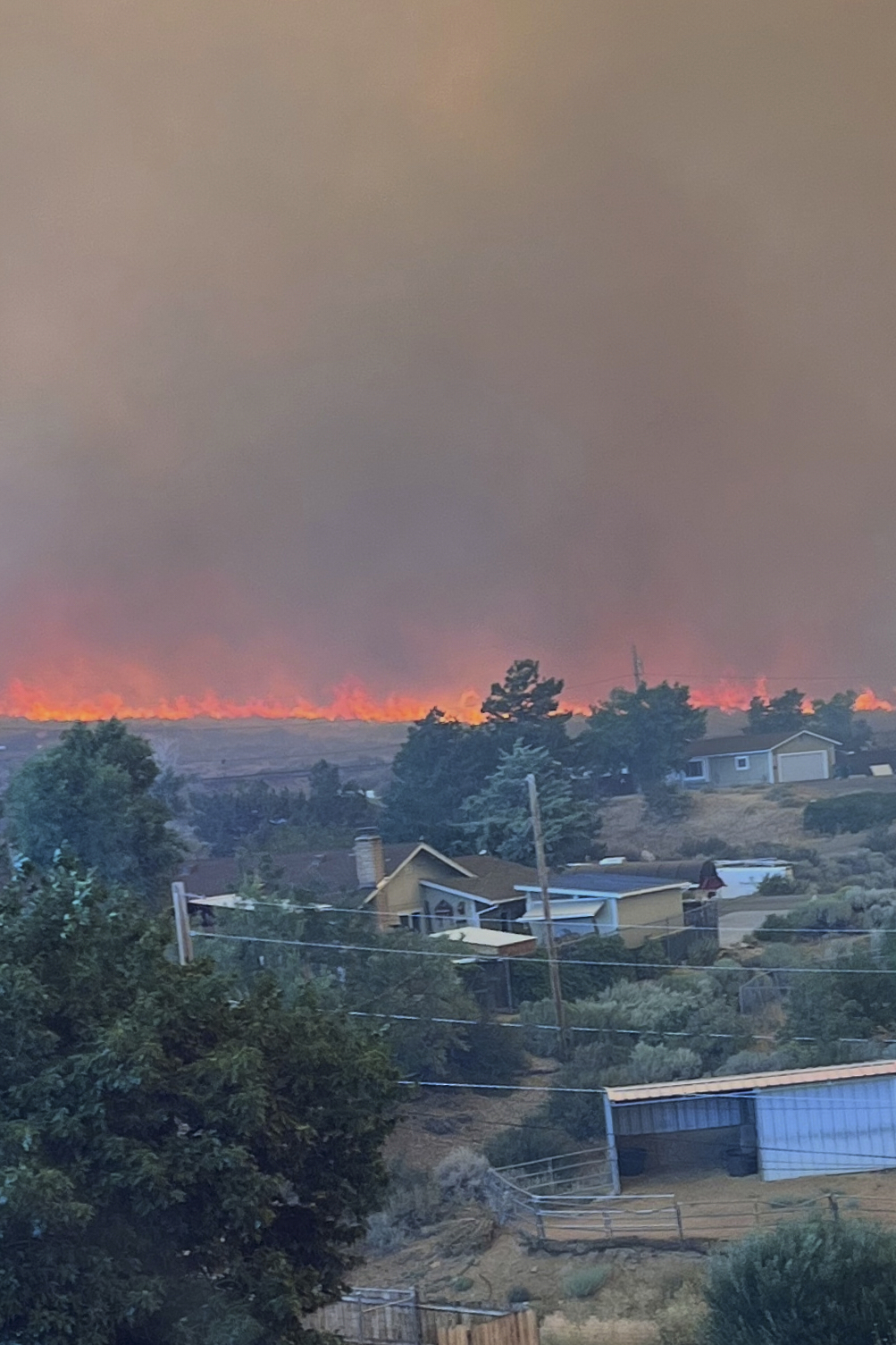 Wildfire started by humans approaches Reno, Nevada, forcing thousands of evacuations
