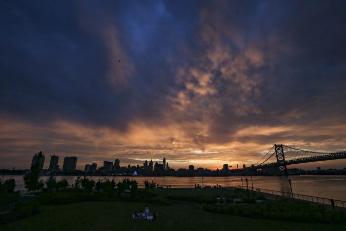 The summer solstice sun sets on Philadelphia as seen from the Camden waterfront in 2022. This year it occurs at 4:24 a.m. on Sunday.