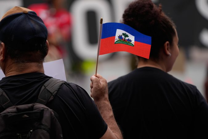 ICE begins outfitting Haitian immigrants with ankle monitors, attorneys say