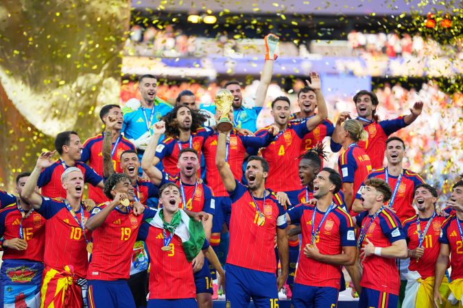 Spain celebrates with the World Cup trophy after defeating Argentina in extra time of the final in East Rutherford, N.J., on Sunday.
