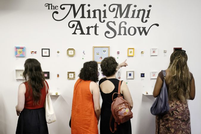 A Queen Village show is drawing big crowds with postage stamp-size art