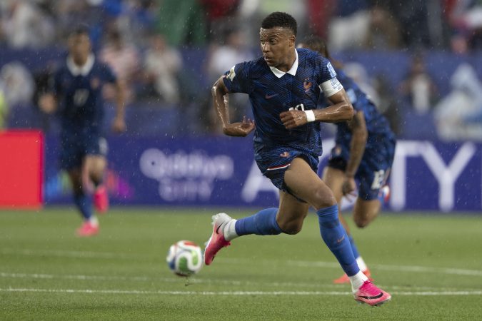 French soccer star Kylian Mbappé sprints for a pass against Iraq during a FIFA World Cup match June 22 at Lincoln Financial Field.