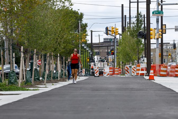 A pedestrian strolls eastbound along the Washington Avenue Connector in South Philadelphia on Thursday.