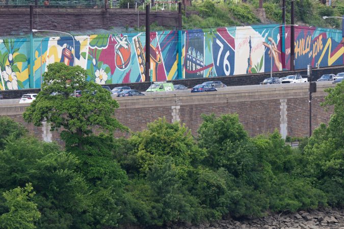 The city has painted a new, wide postcard style mural at the CSX/Amtrak wall as part of the "Gateways to Philadelphia" cleanup initiative. It reads, "From Philly, With Love", in Philadelphia, June 17, 2026.