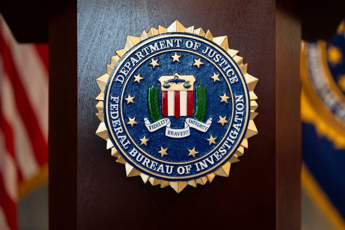 A former Defense Department employee pleaded guilty to laundering money for Nigerian scammers