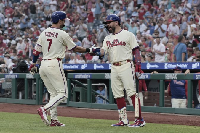 Trea Turner celebrates his fifth inning solo home run with Kyle Schwarber (right) during the Phillies' win on Saturday. Schwarber also hit a homer in the first.