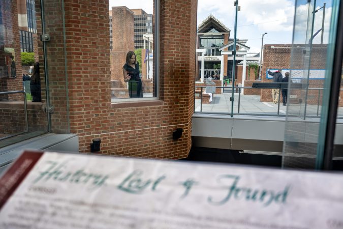 Carol Quillen (rear, left), president and CEO of the National Trust for Historic Preservation, visits the President’s House in Independence National Historical Park in April, looking at signs and notes left by visitors.