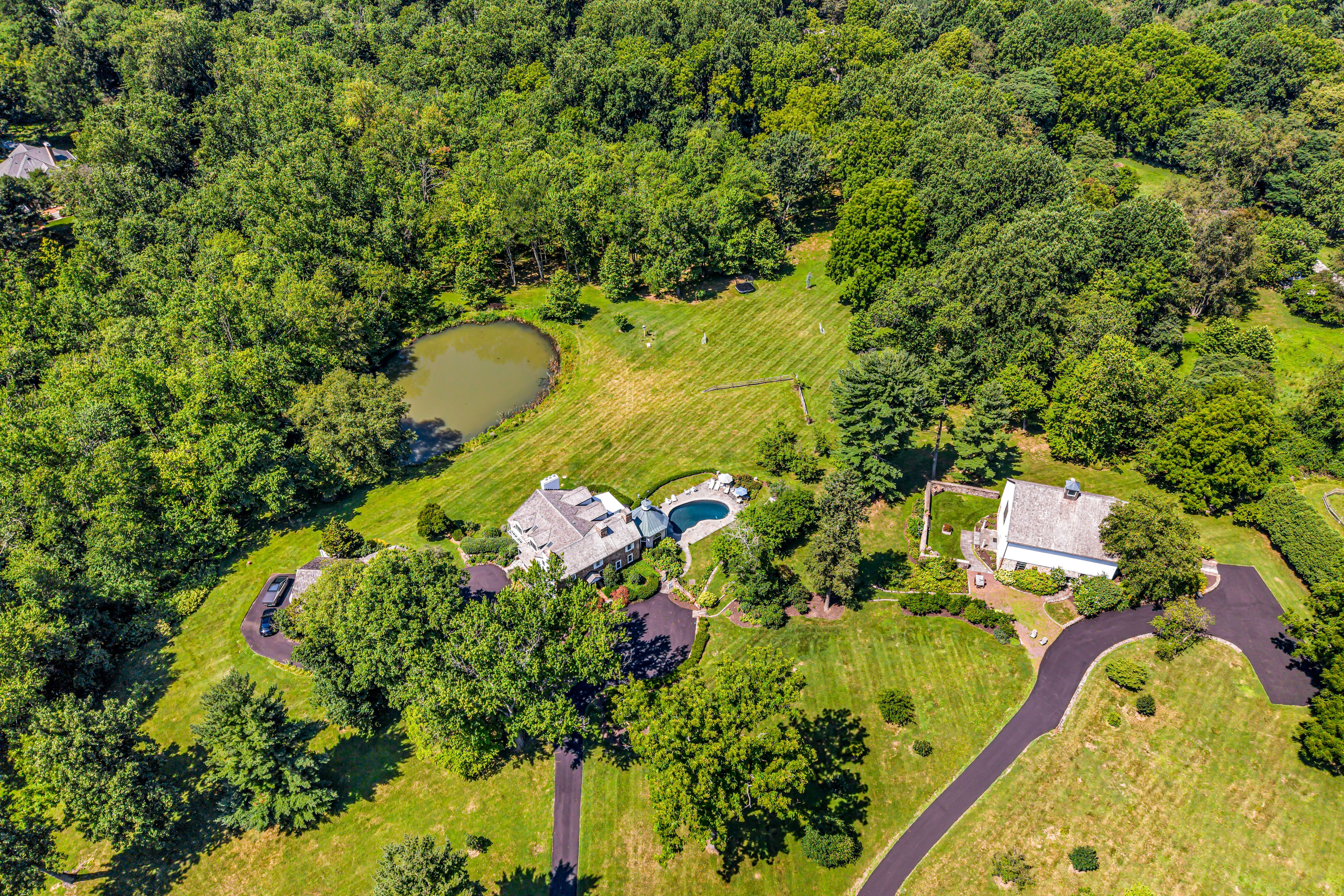 A 27-acre compound with two homes and pools is for sale for $9 million in Chester County