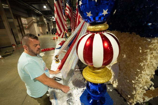 Float builders are transforming history into colorful, sequin-filled displays for the Semiquincentennial parade
