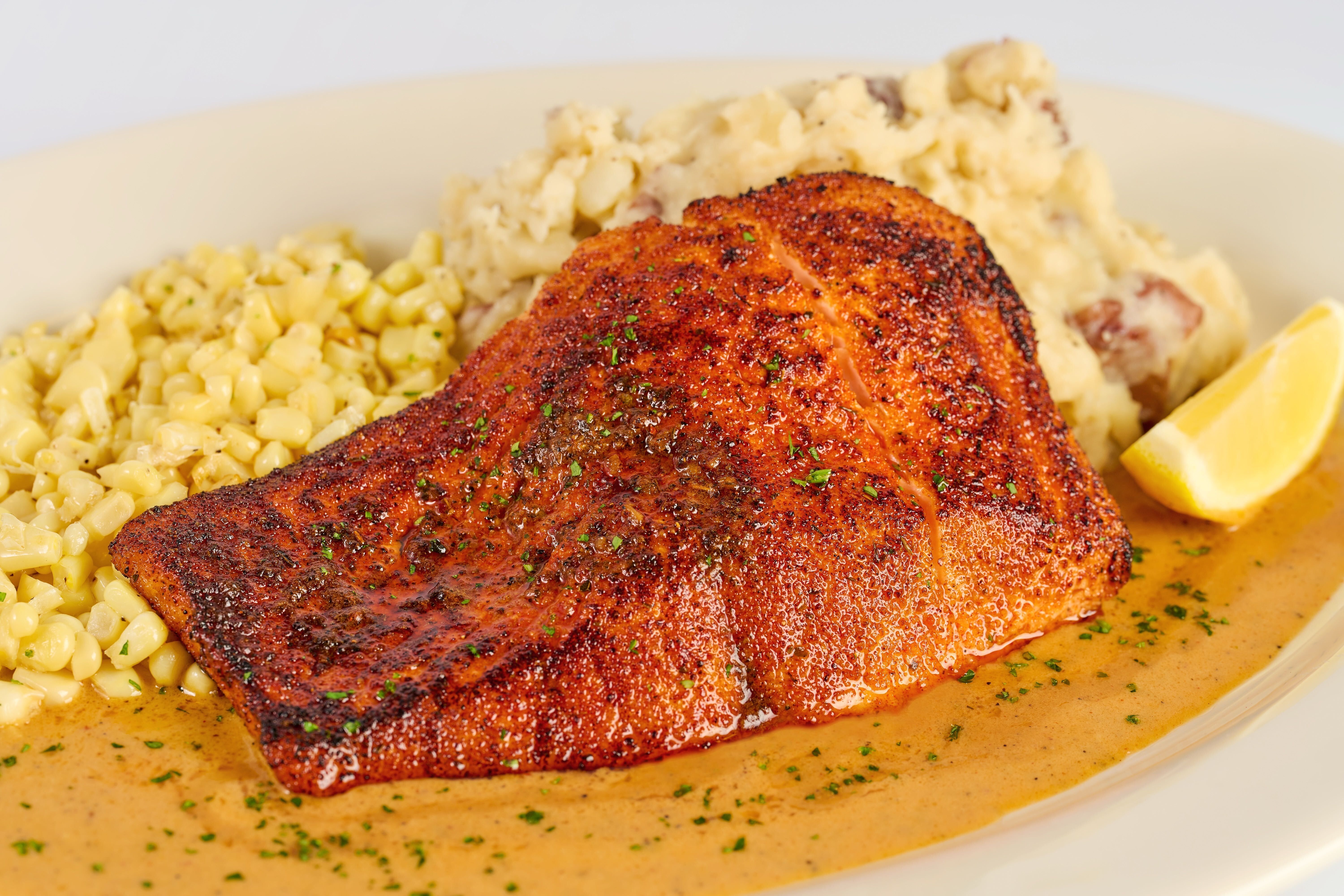 Cheesecake Factory’s Cajun salmon is having a TikTok moment. It’s bringing local crowds — and headaches.
