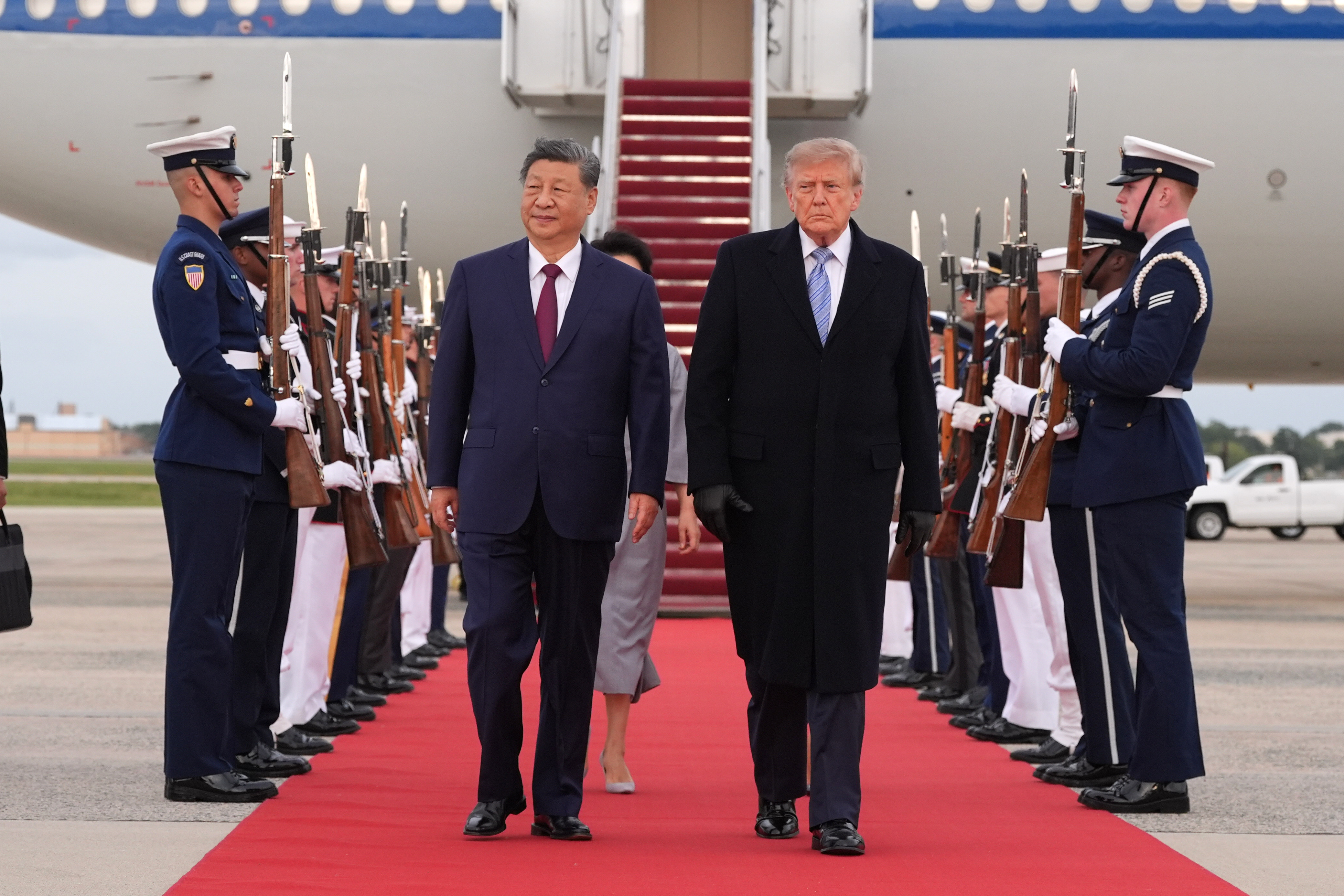 China’s Xi arrives in Washington, kicking off his state visit with rare planeside welcome from Trump