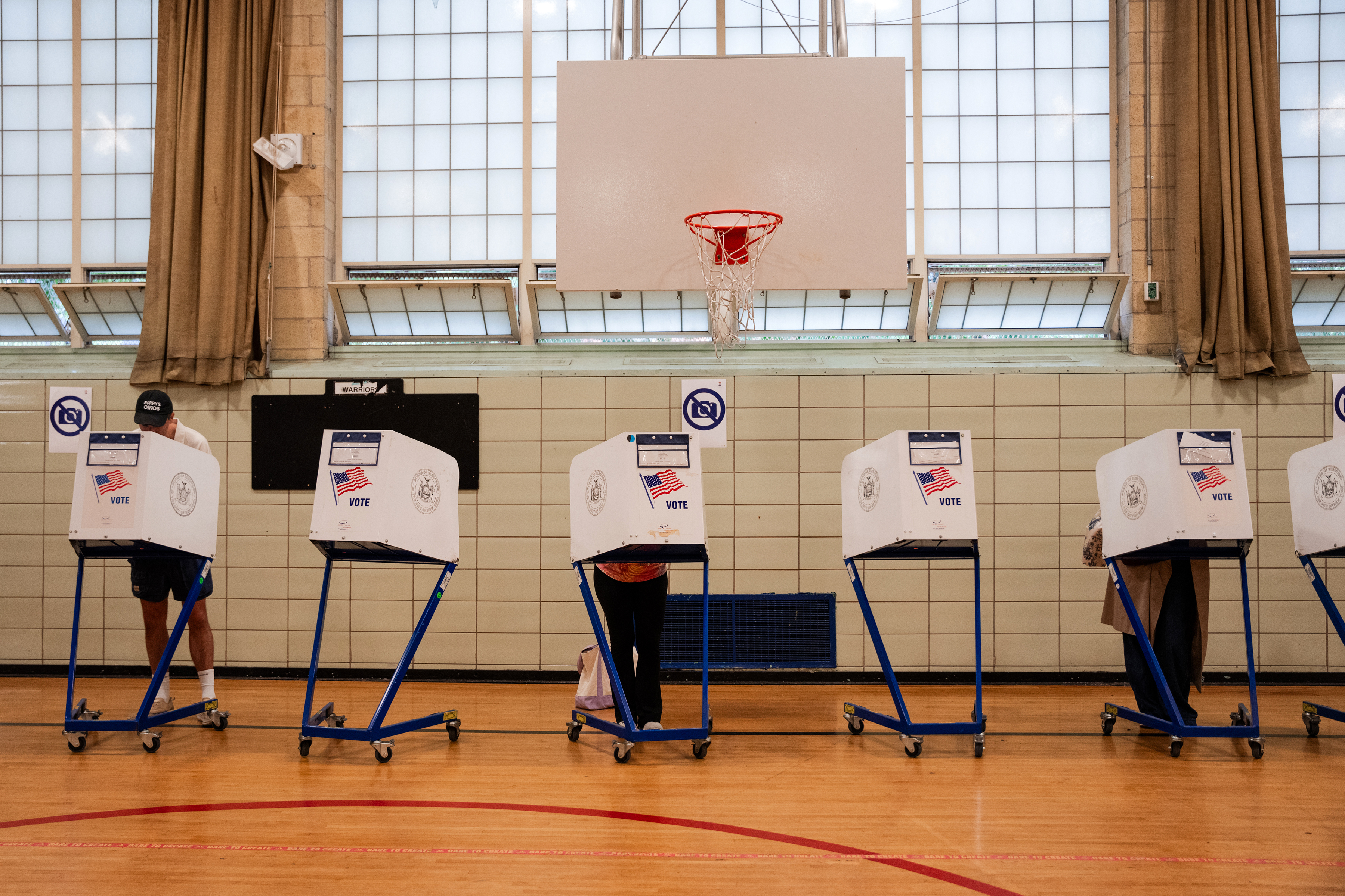 Civil rights groups sue to keep armed agents away from voting sites