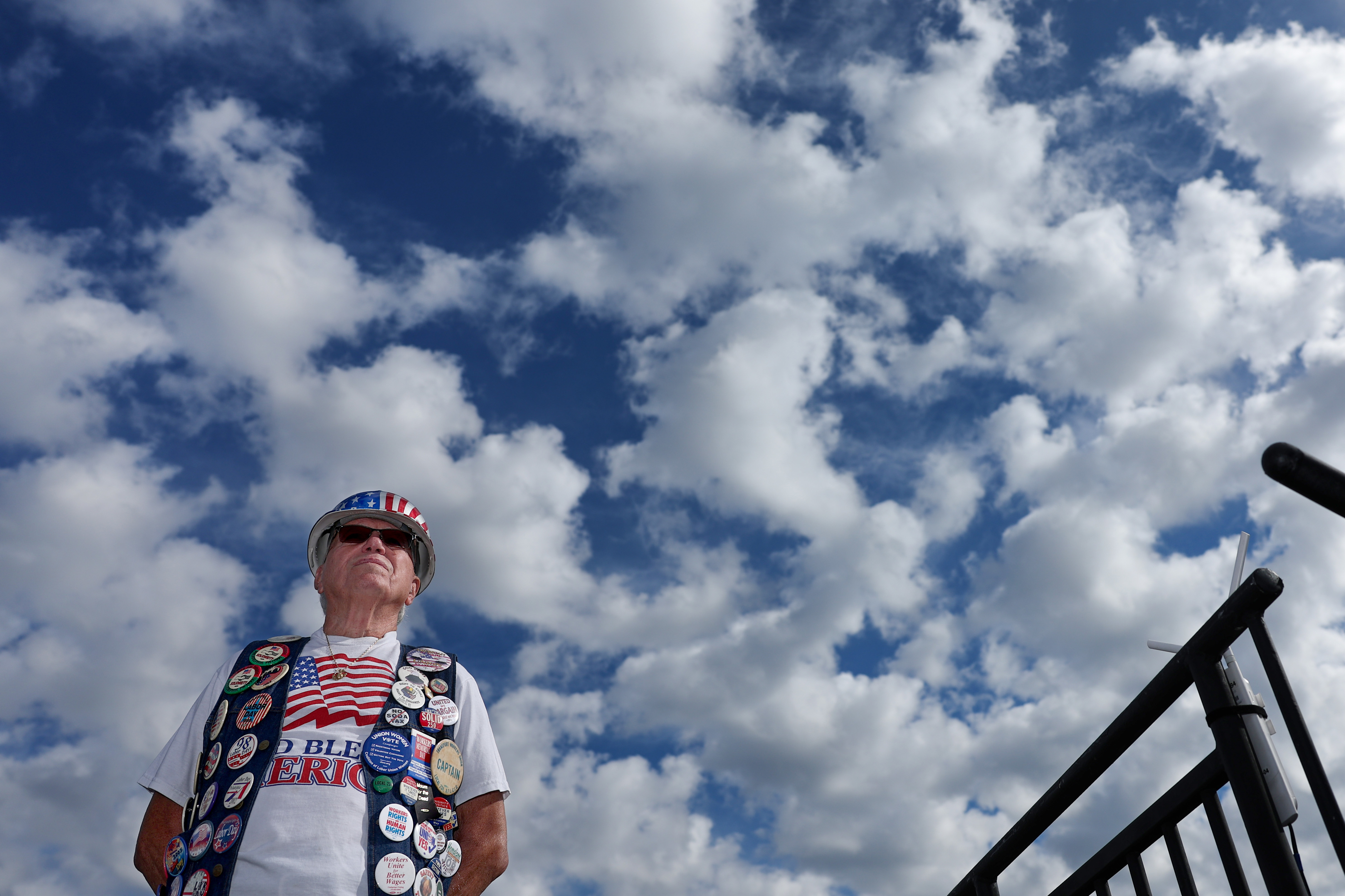 John A. Greer III, who is the co-chair of the parade, listens to speeches from labor union leaders before the start of annual Tri-State Labor Day Parade in Philadelphia on Monday, Sept. 1, 2025. Greer said he has attended all thirty-eight parades over the years and has a button from all but one. “The first year of the parade we didn’t have a button,” he said.
