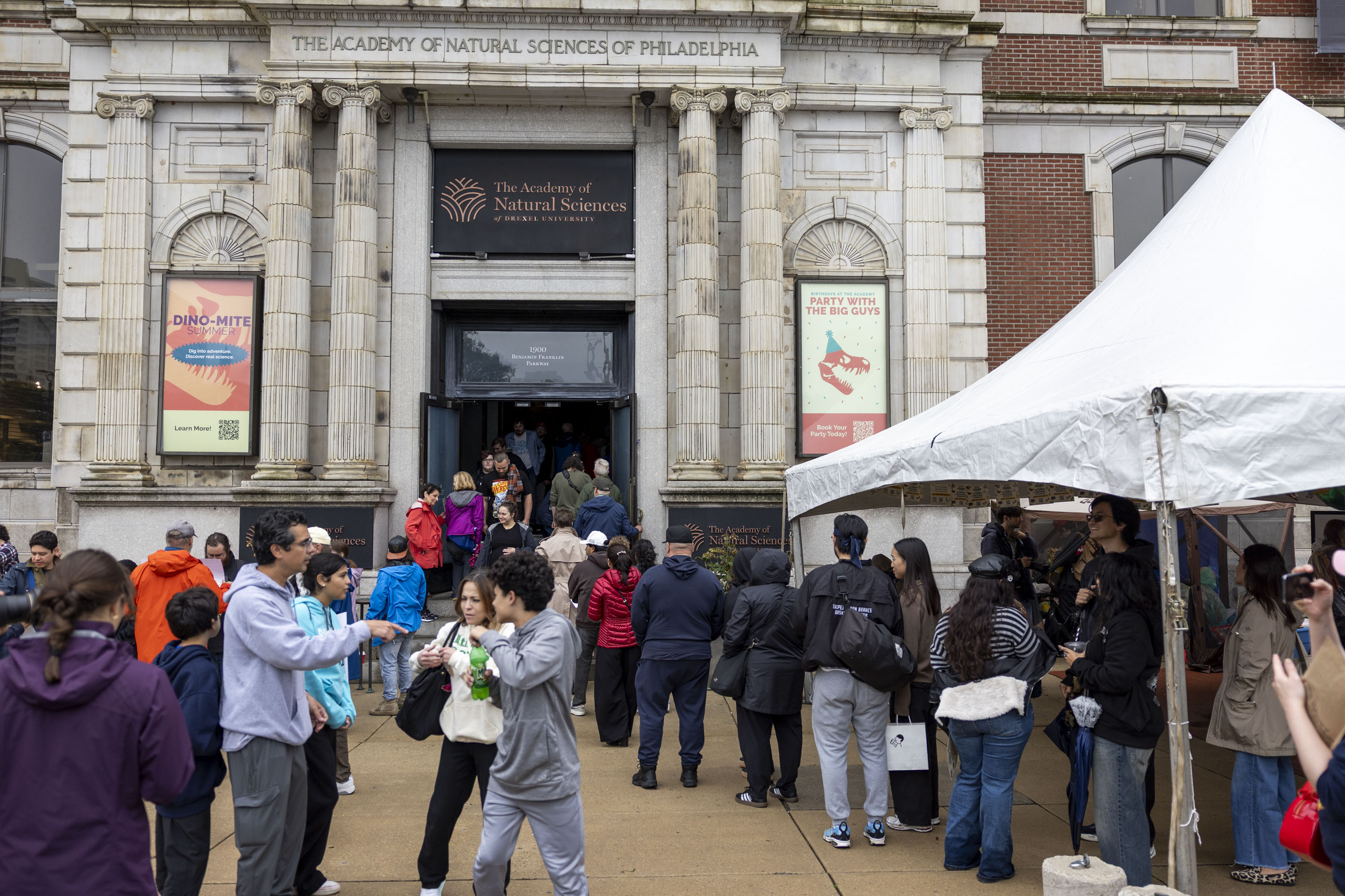 Ahead of Sunday’s final day, families brave the rain to protest academy closure