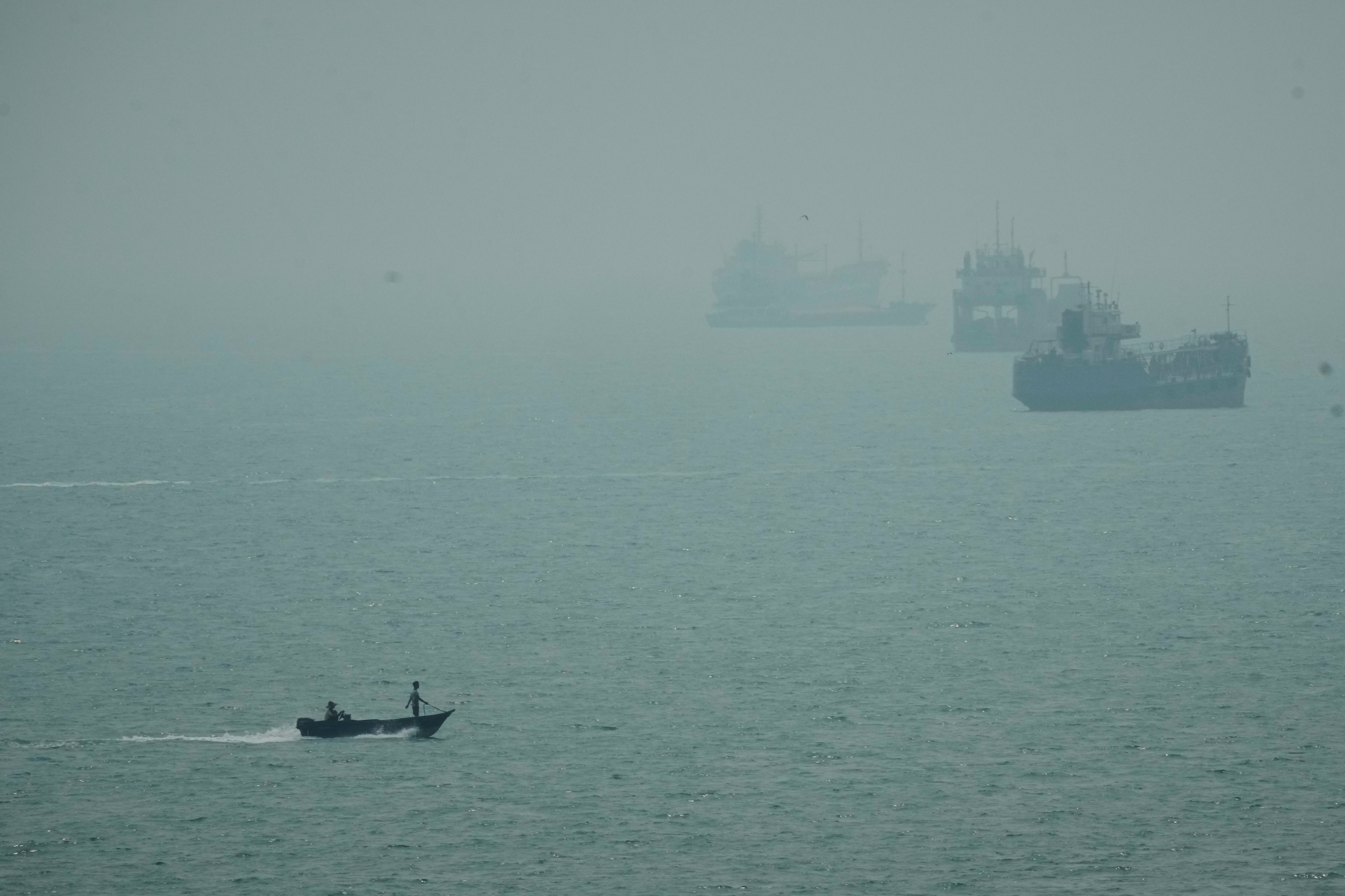 Iranian cargo ship is struck, and talks between Tehran and its neighbors are postponed
