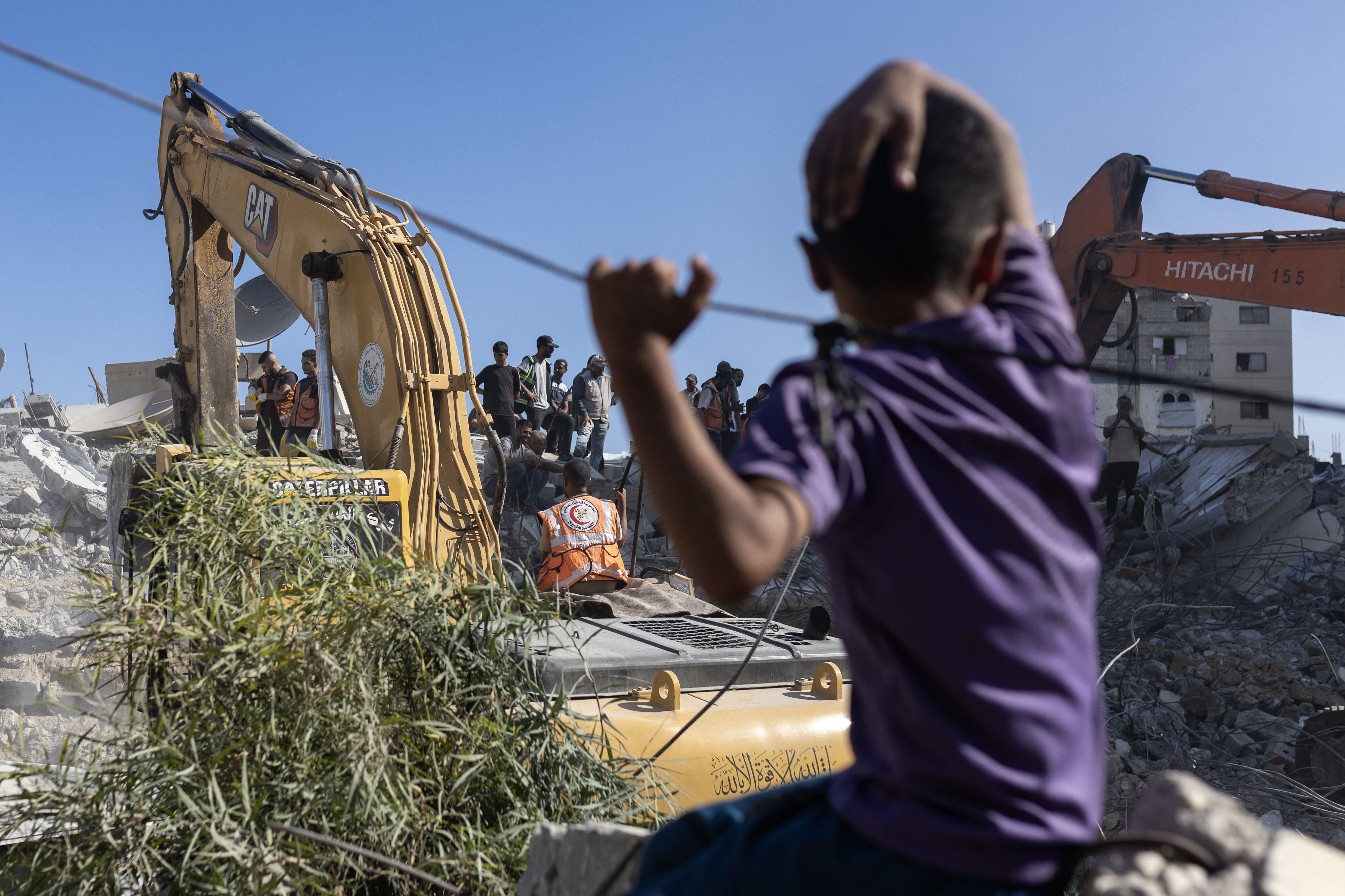 At least 21 dead in Gaza after building collapse, officials say