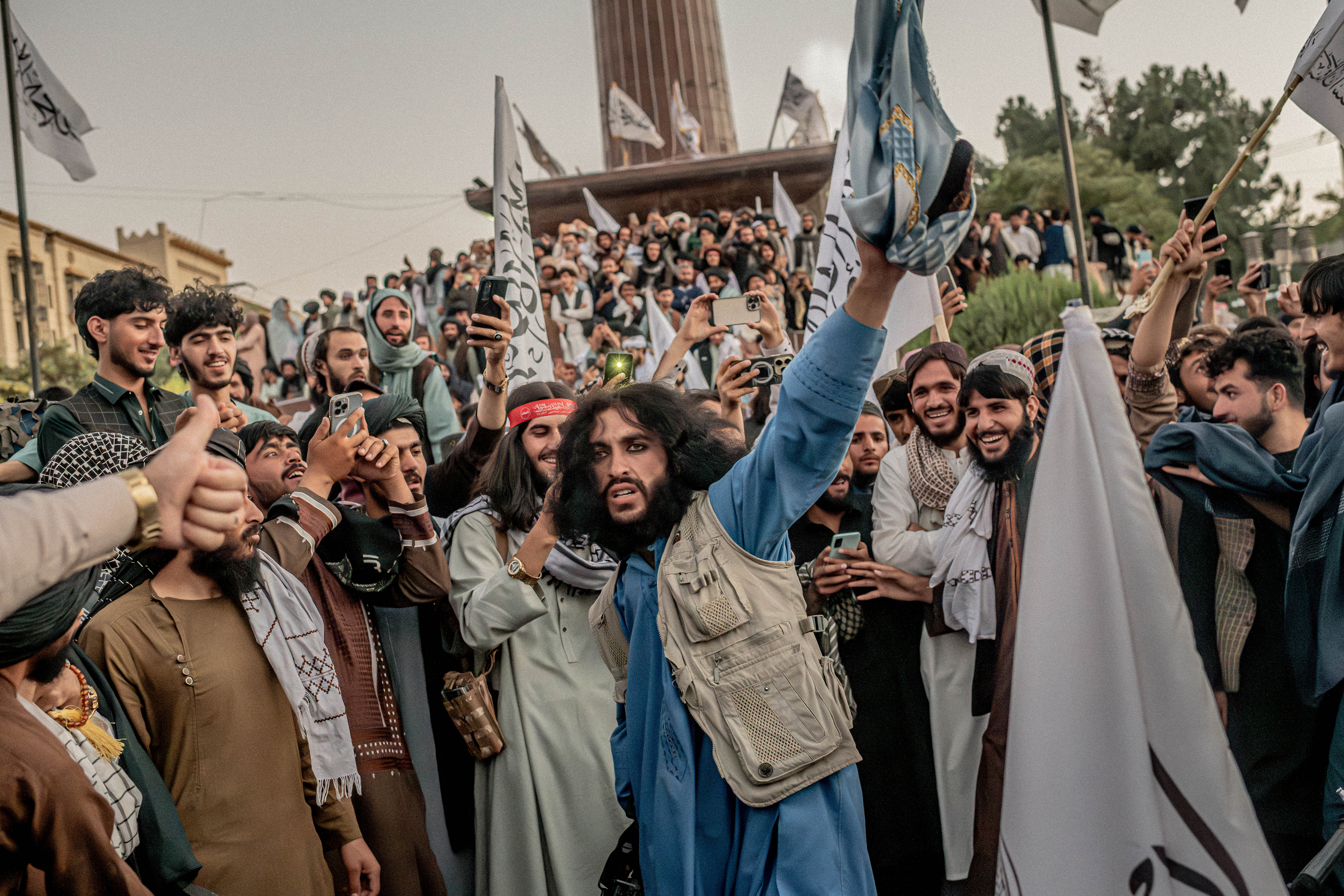 A large crowd dances and celebrates for the anniversary of the Taliban’s return to power in Kabul, Afghanistan, Aug. 15, 2026. The Taliban returned to power five years ago, in what they call the “liberation” of Afghanistan, but for millions of Afghans, the Taliban’s rule means anything but liberation. They are now rebuilding the country after 20 years as an insurgency and many of the security threats that have plagued Afghanistan for decades are still there. (Tomas Munita/The New York Times)