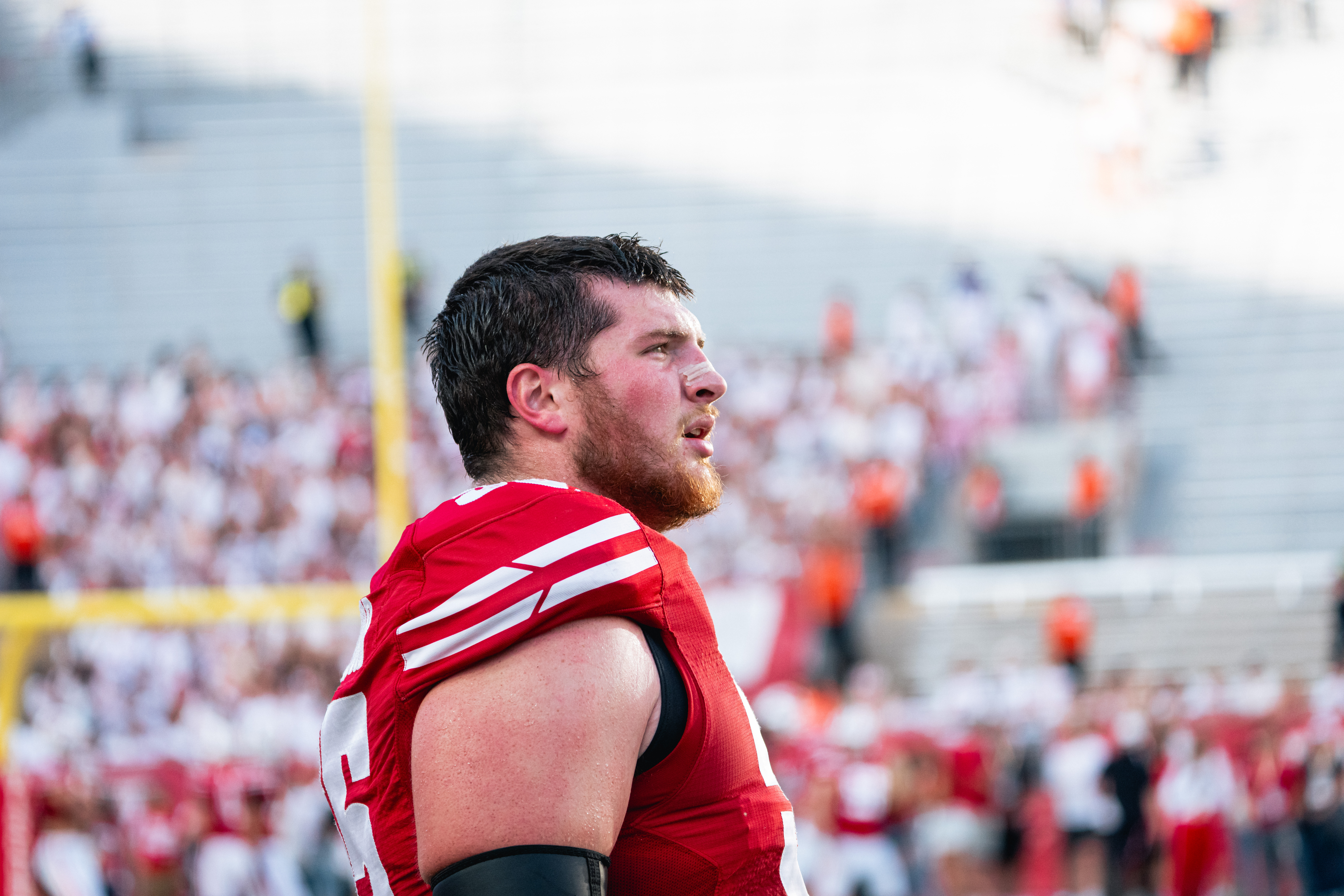 Pope John Paul II grad Kevin Heywood overcame an ACL tear to become Wisconsin’s starting OT