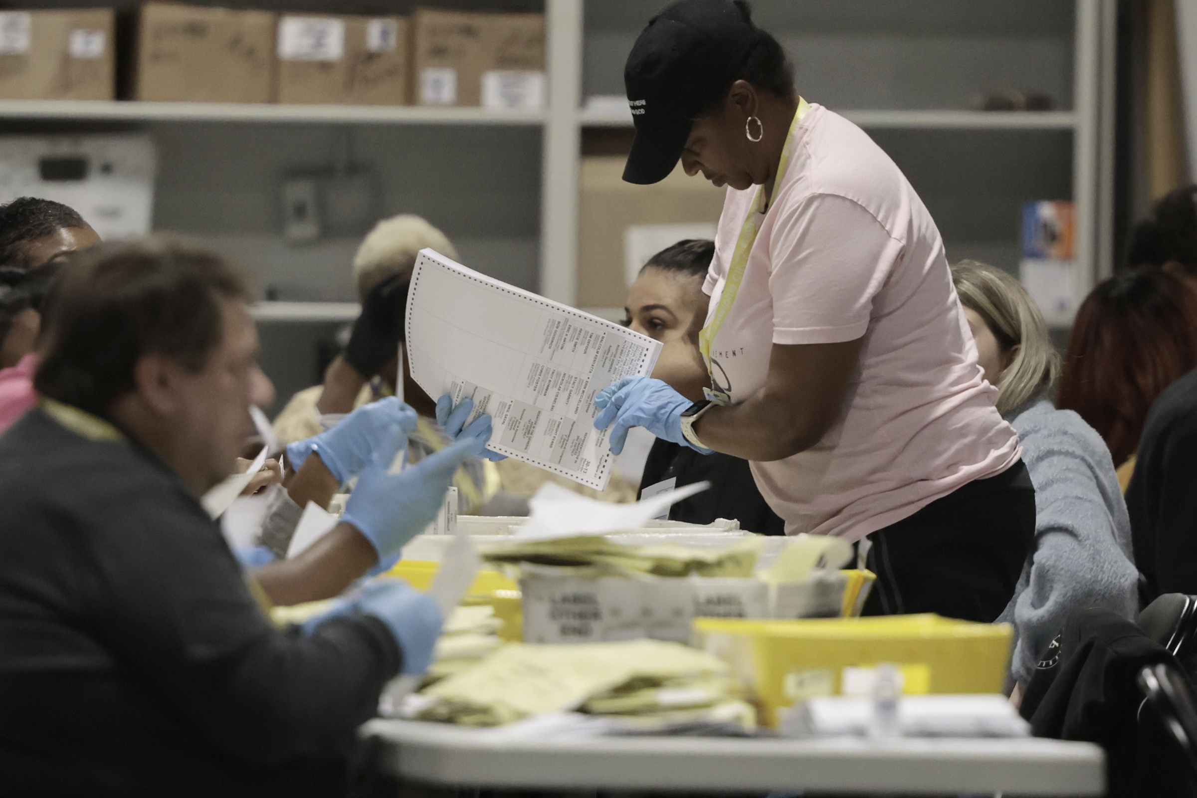 Election workers take ballots out of their inner envelopes at Philadelphia’s election warehouse in 2024. Responsible public officials distinguish between voting irregularities and voter fraud when discussing election security, writes Daniel Pearson.