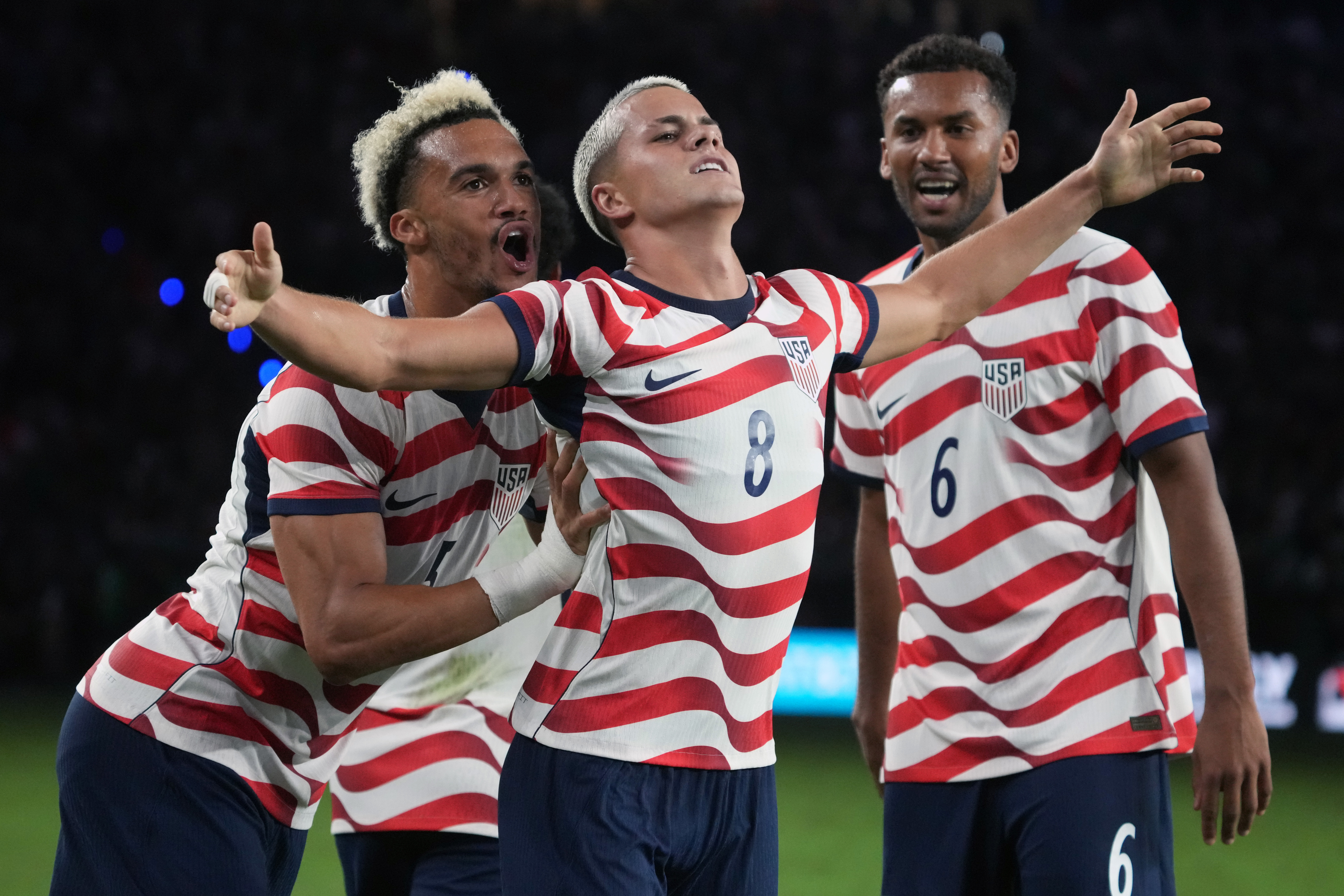 Cavan Sullivan (center) celebrates his goal against Mexico with Media native Auston Trusty (right) and Antonee Robinson.