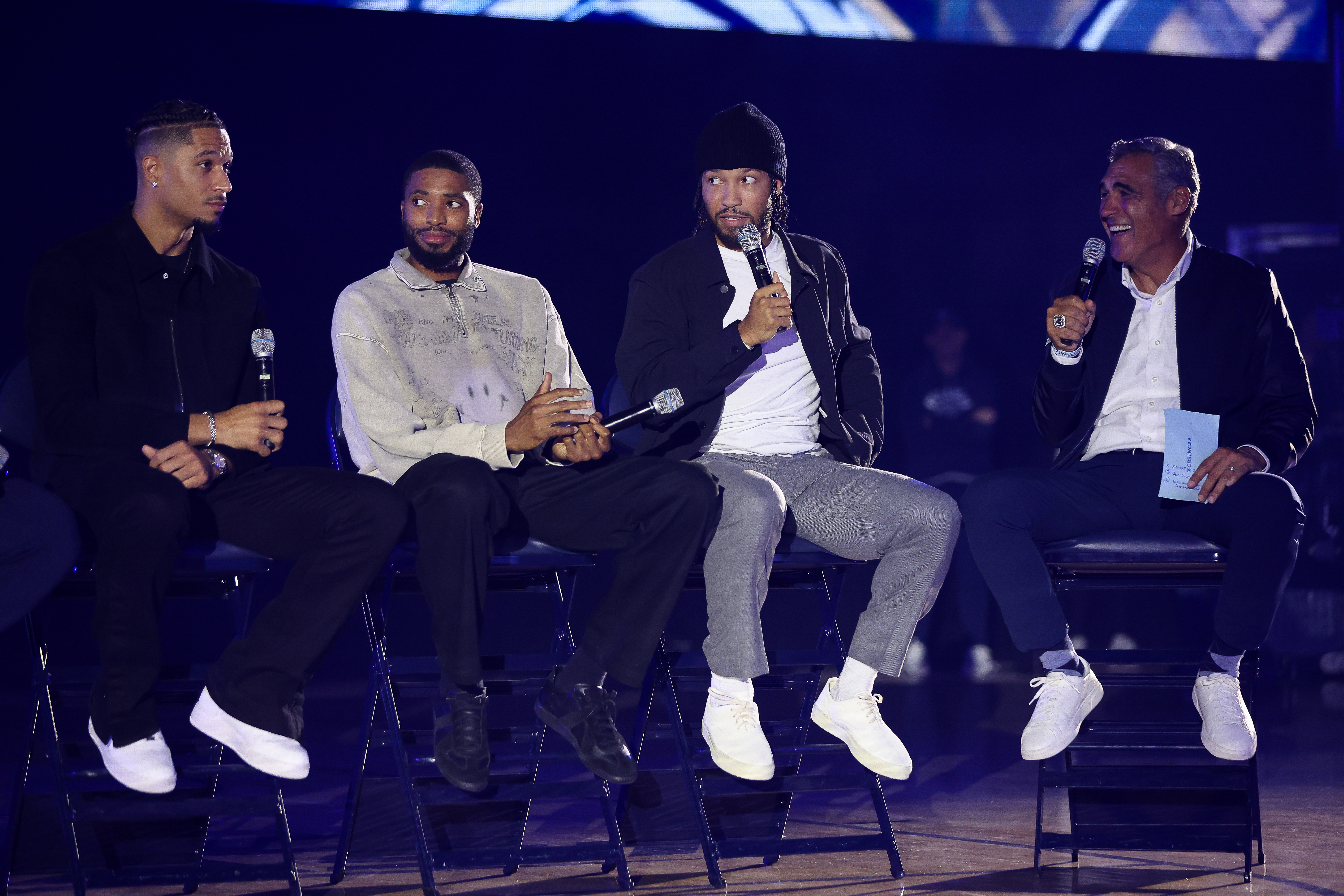From left to right: Josh Hart, Mikal Bridges and Jalen Brunson speak alongside former coach Jay Wright during the Villanova tip-off event at Finneran Pavilion on Sunday.