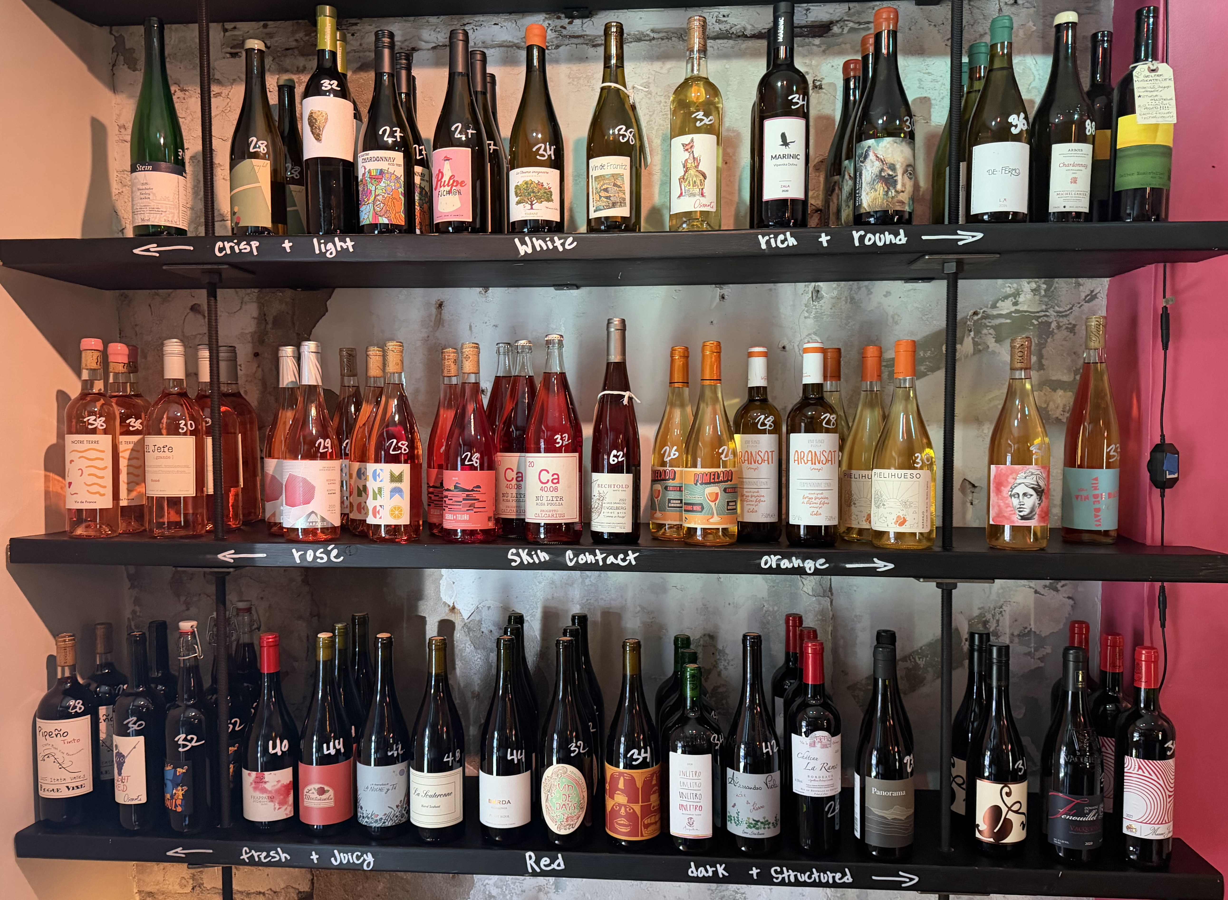 The wine shop at wood-fired restaurant Sally prioritizes natural producers and spans one wall.