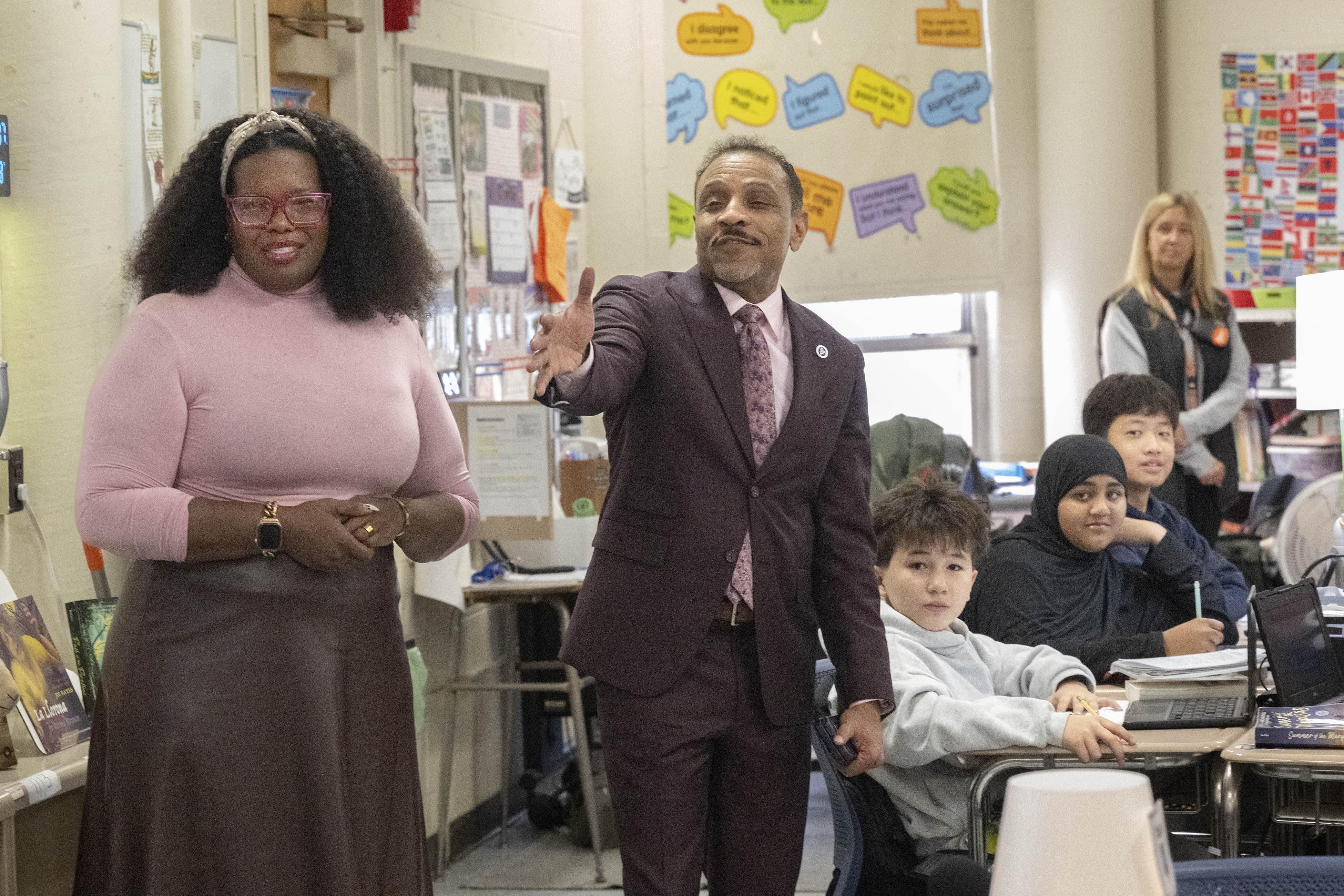 Philadelphia School District Superintendent Tony B. Watlington Sr. and Baldi Middle School Principal Bianca C. Gillis talk with eighth grade students about the school’s new digital hall pass system.